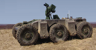 Illustration for article titled DARPA's Crusher Drives Itself, Laughs at Your Puny "Traffic"